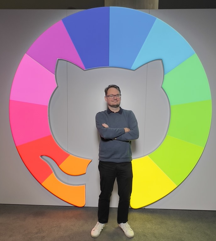 Tomas Herceg at Microsoft Ignite in front of GitHub logo